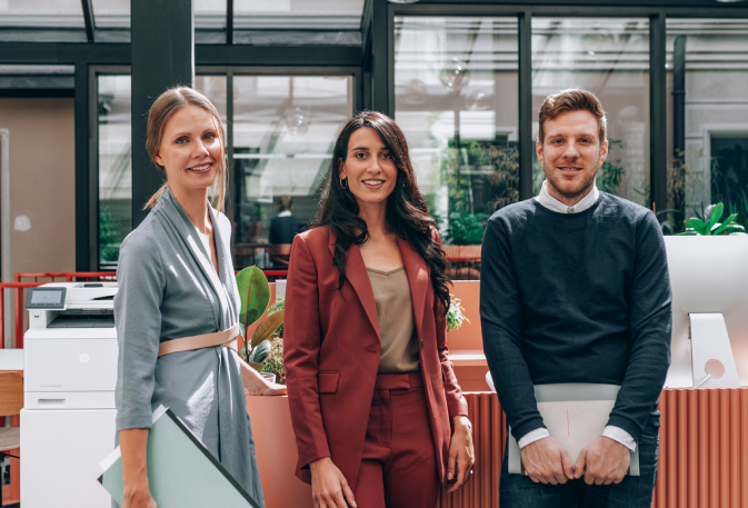 Team standing in office
