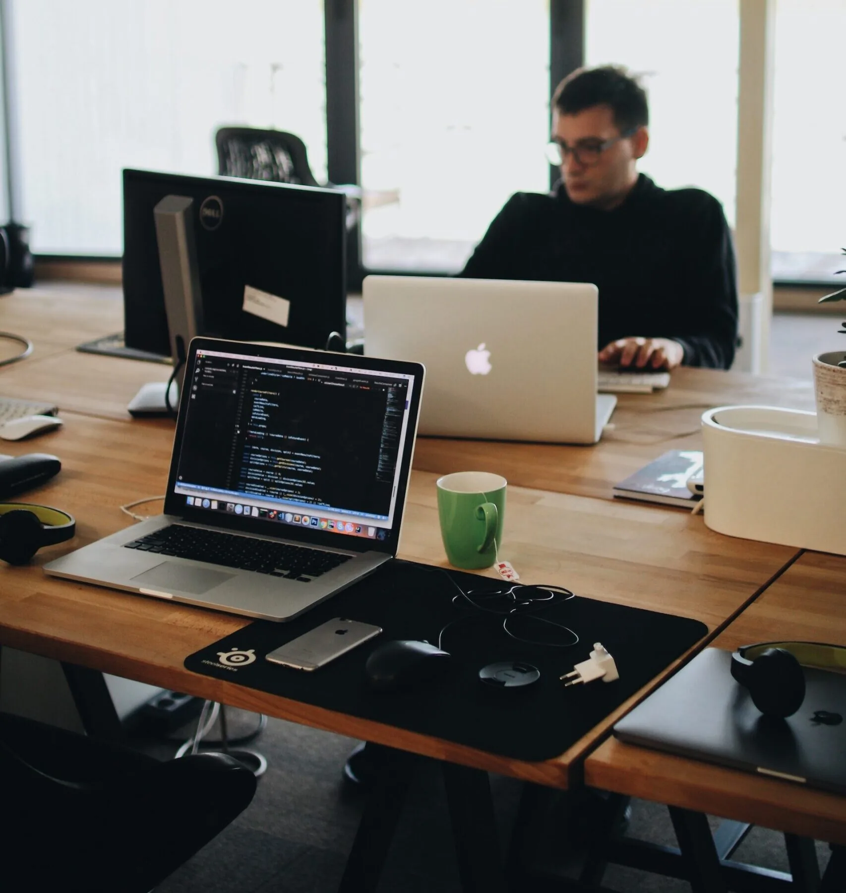 A man sitting alone at an office desk