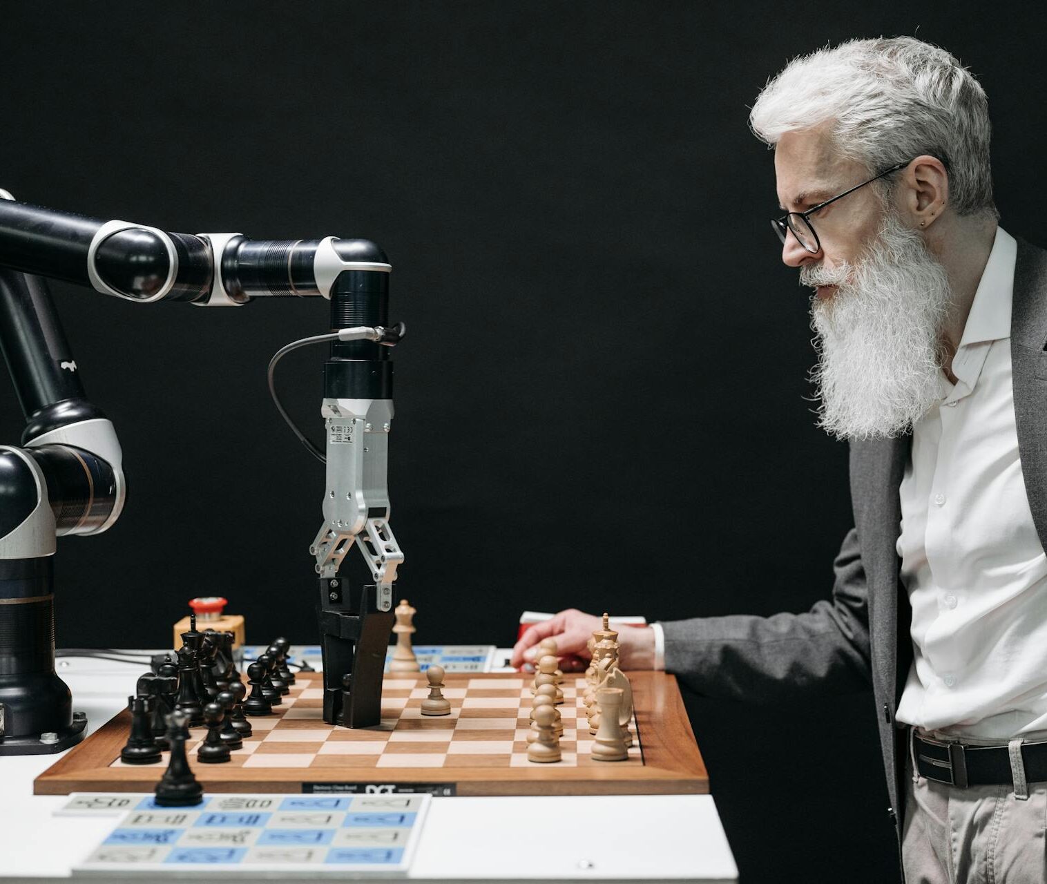 A man playing chess against an AI employee