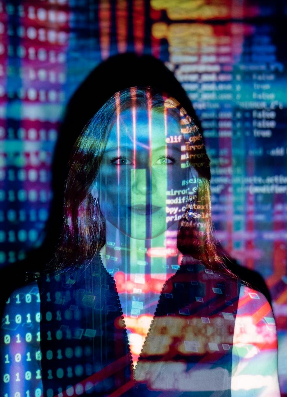 AI text projected over an employee's face. Will AI replace human jobs?